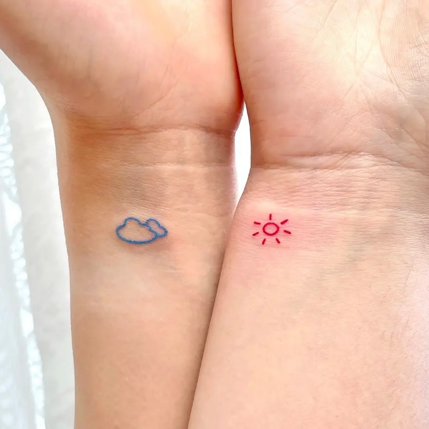 Delicate cloud and sun tattoos for mom and daughter