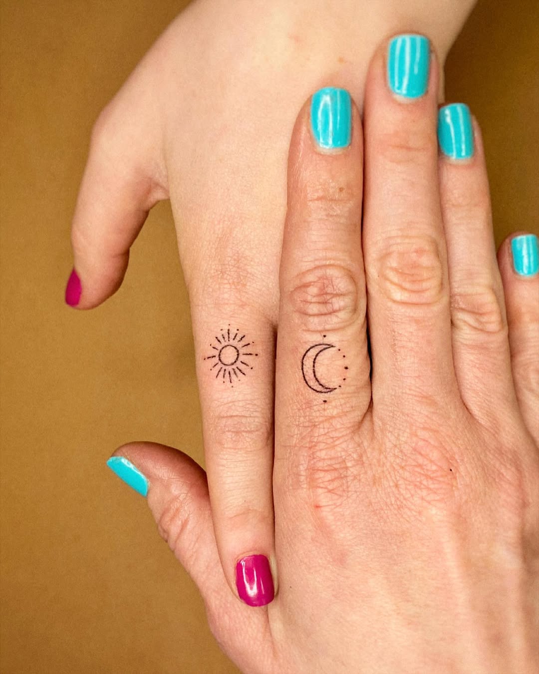 Delicate sun and moon tattoos for connection
