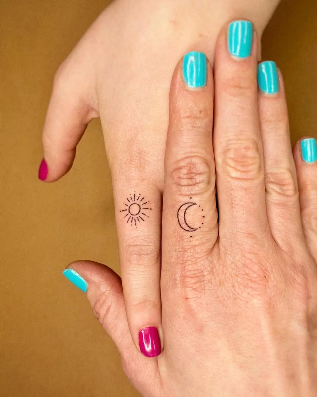 Delicate sun and moon tattoos for connection