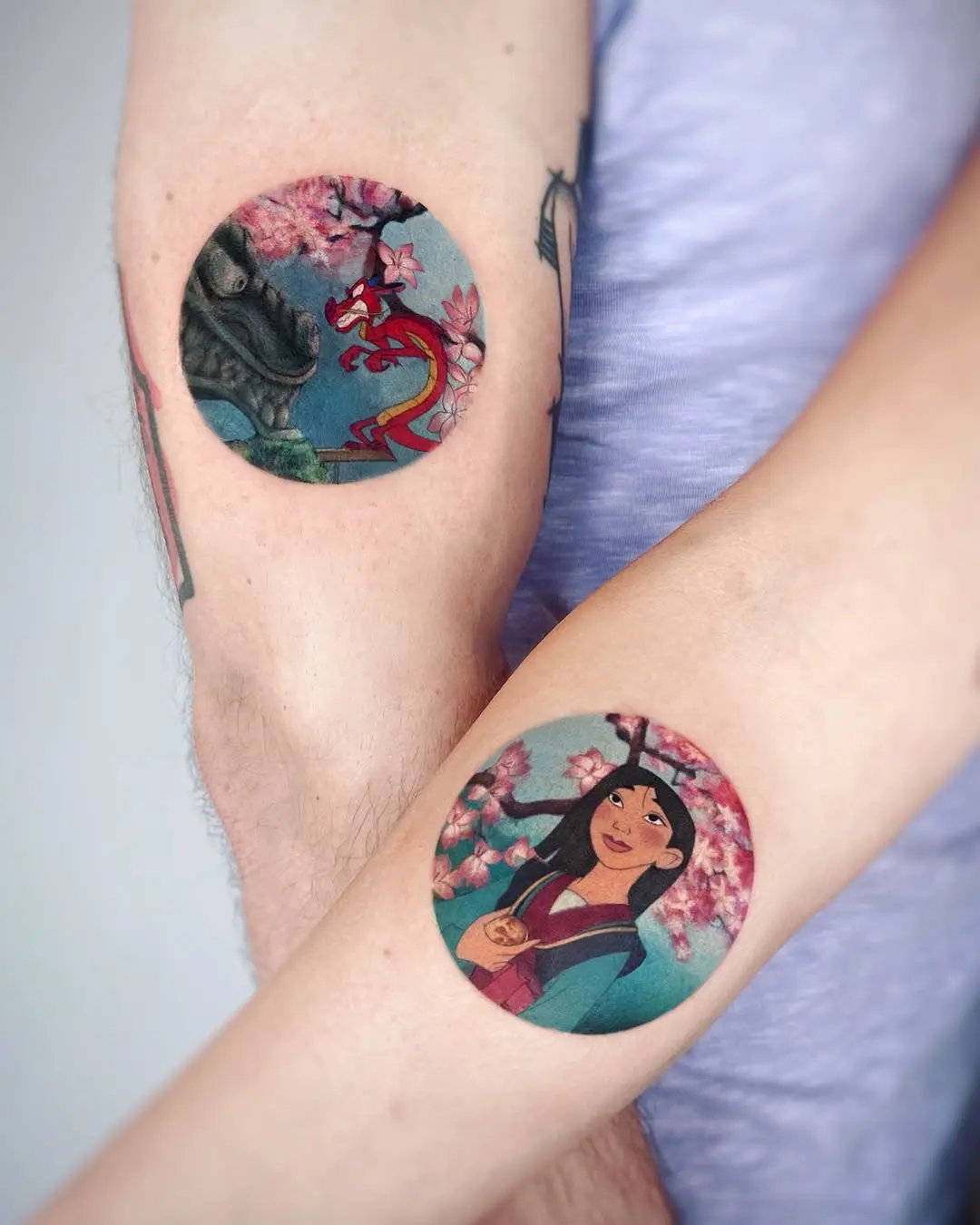 Mulan-inspired tattoos with cherry blossoms