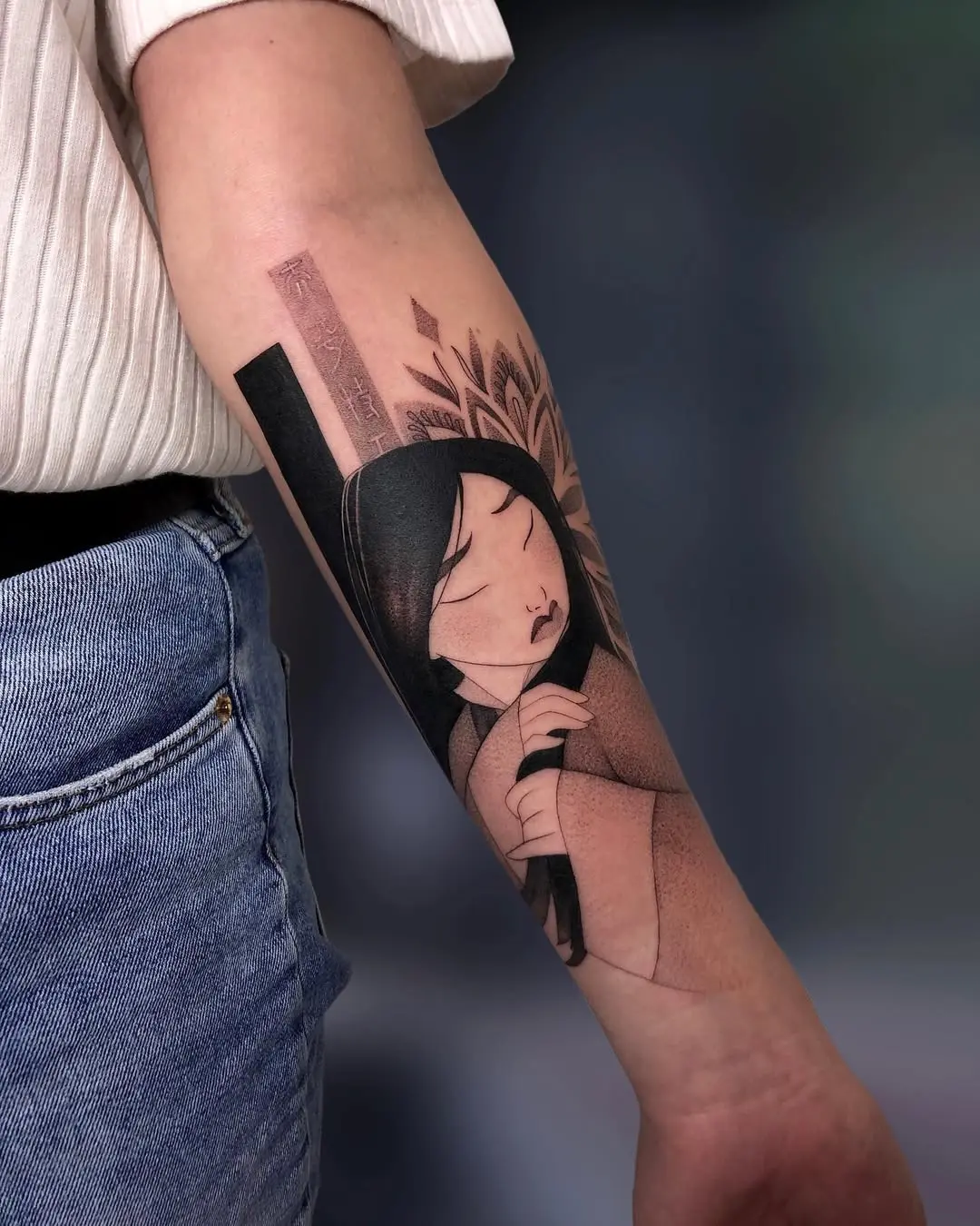 Elegant Mulan tattoo with nature elements