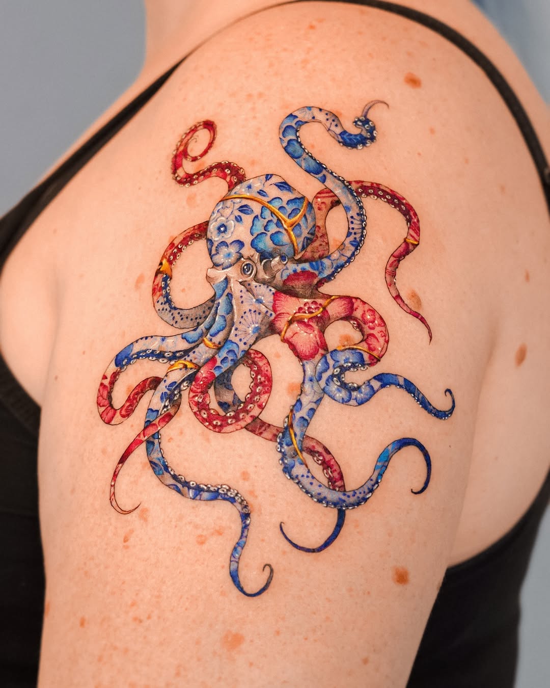 Vibrant octopus tattoo with kintsugi details