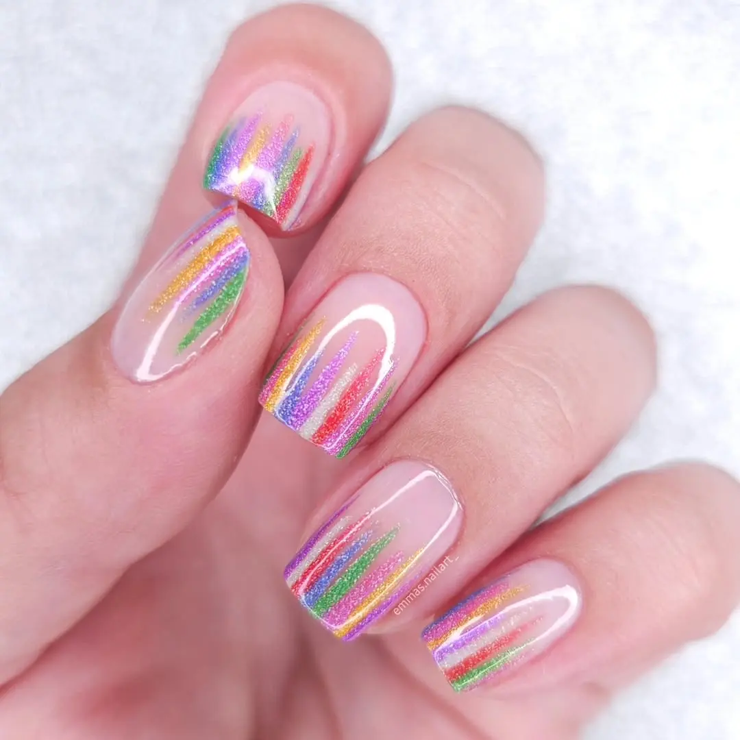 Vibrant rainbow nails with sparkling accents
