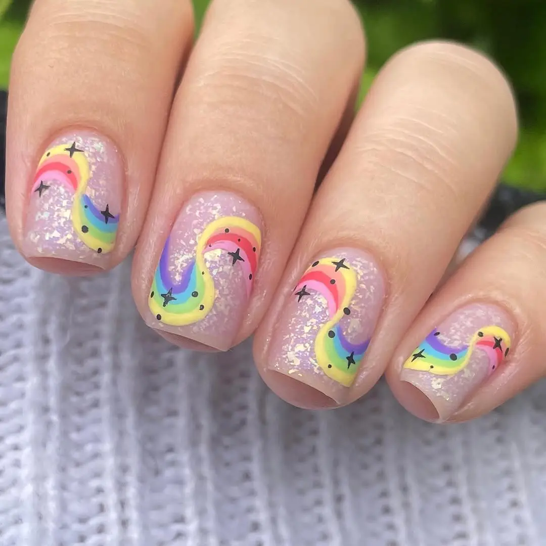 Colorful rainbow nails with sparkling accents