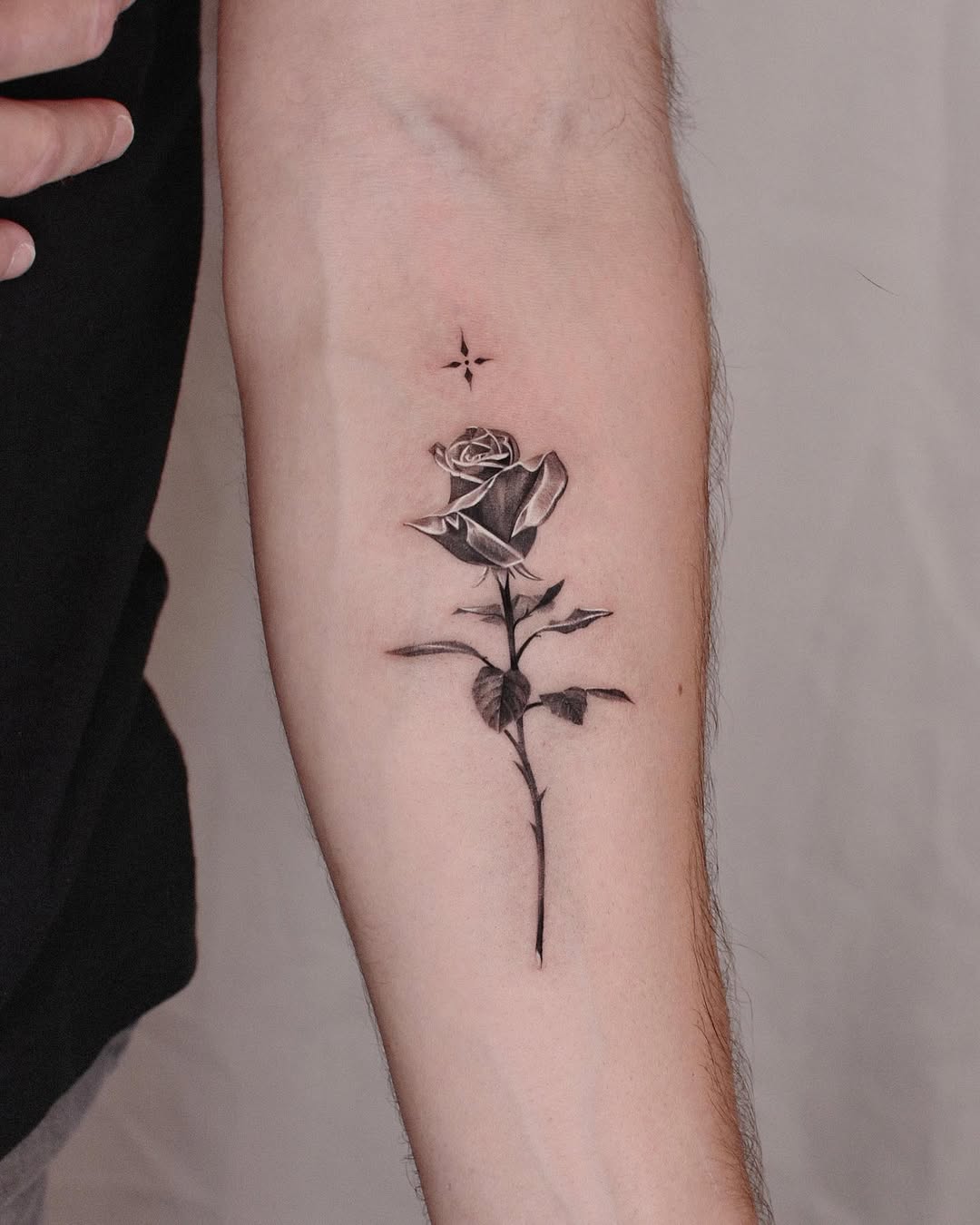 Stunning rose tattoo on a woman's forearm
