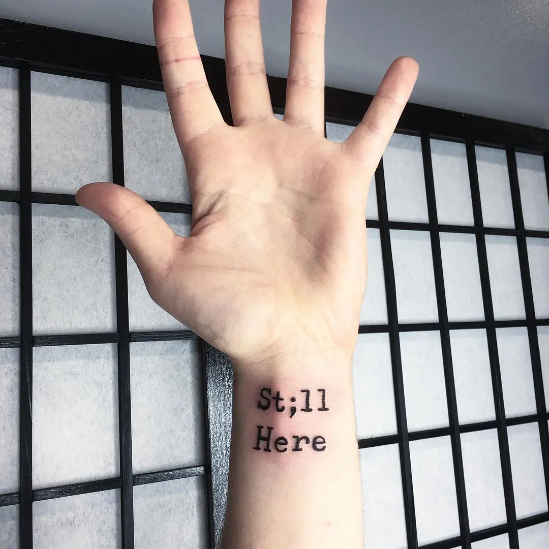 Meaningful semicolon tattoo on the wrist
