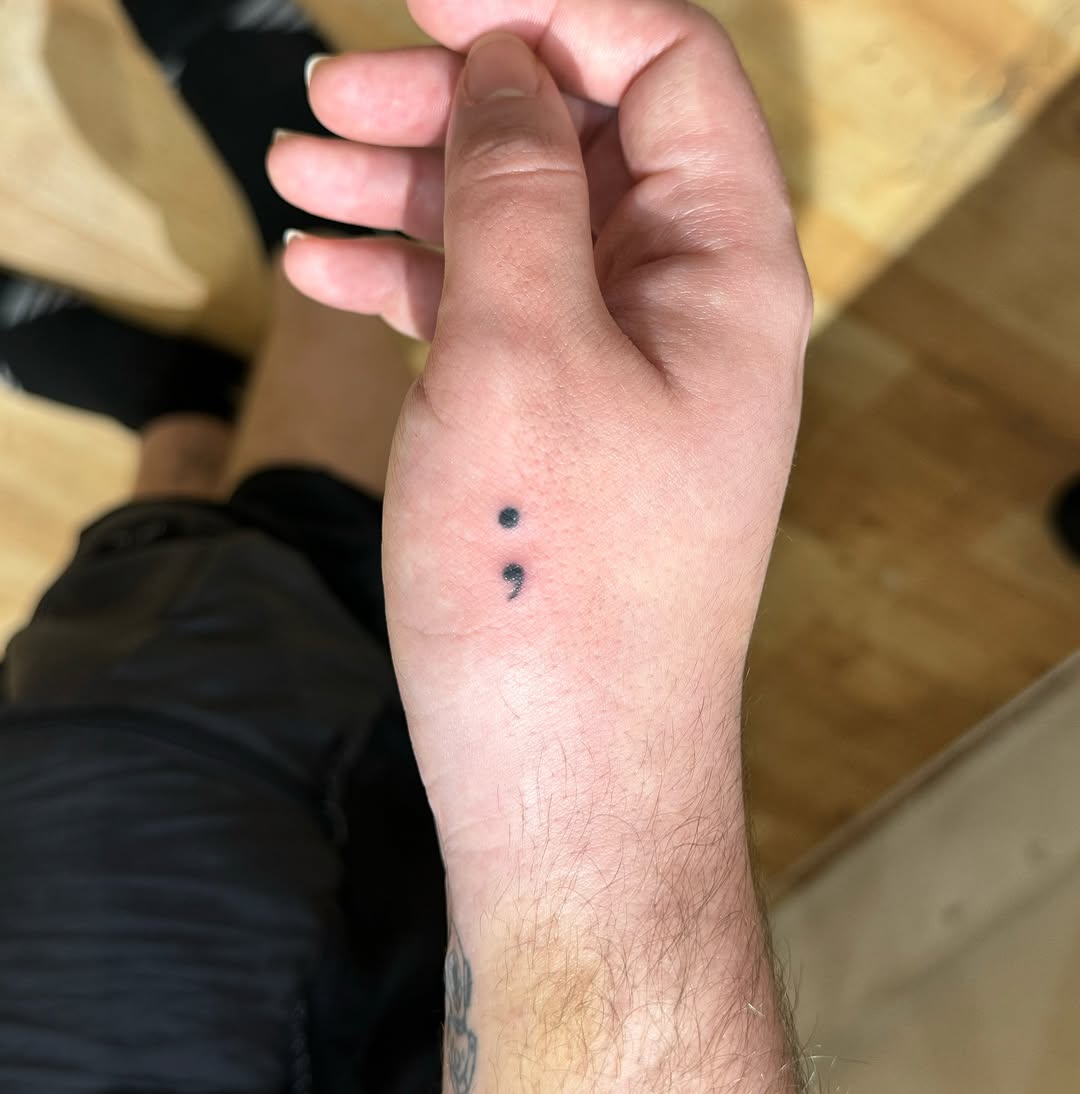Meaningful semicolon tattoo on wrist
