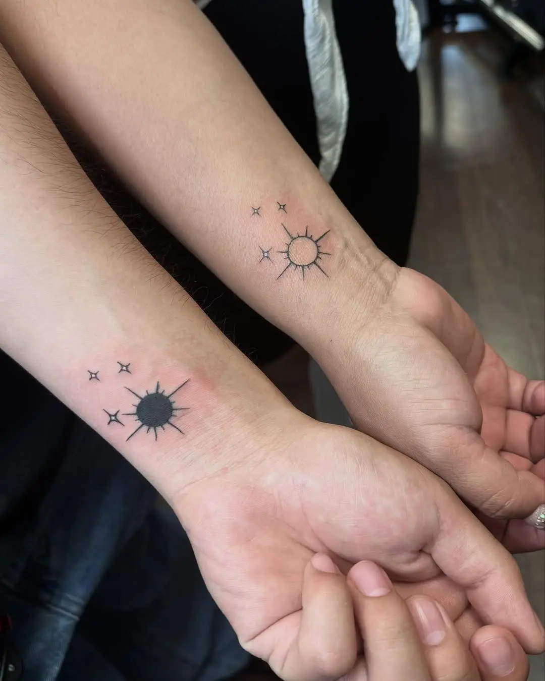 Sun and moon tattoos symbolize sibling bond