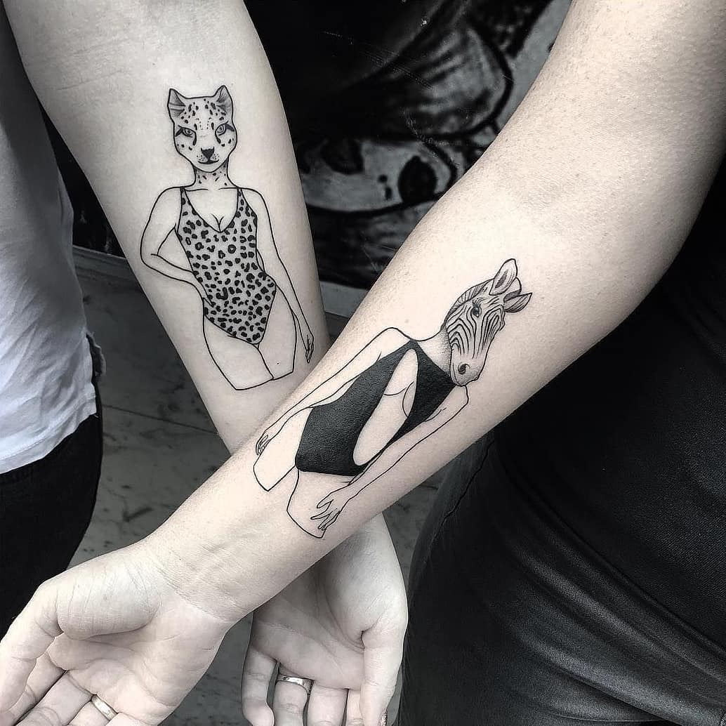 Stylish sibling tattoos with animal themes