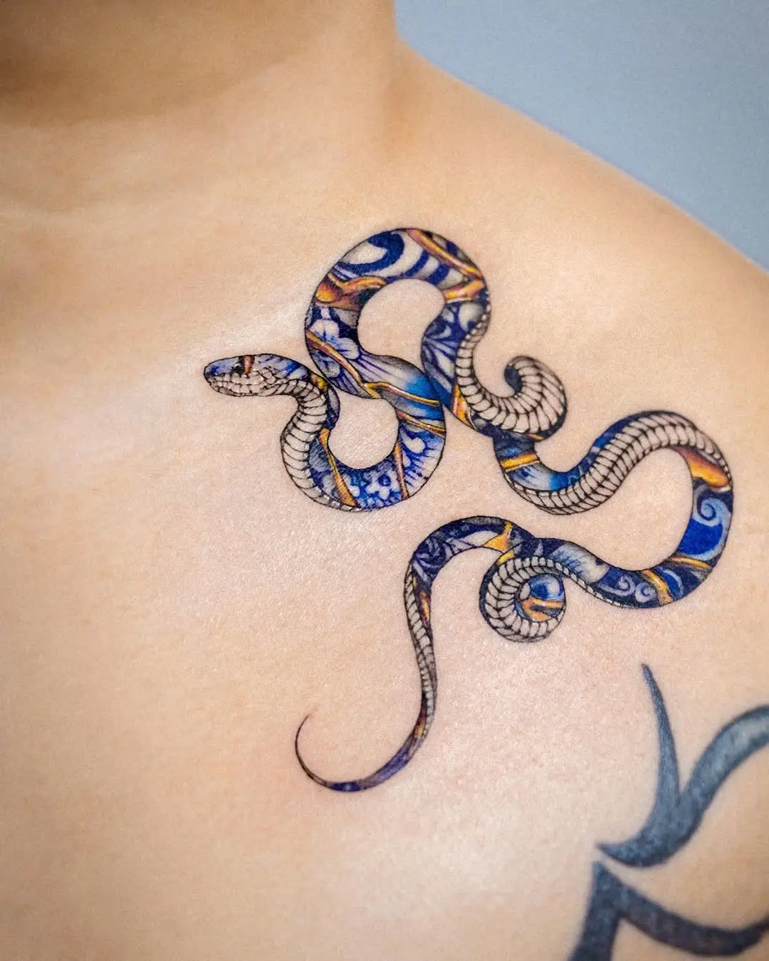 Vibrant Kintsugi Snake Tattoo on Skin