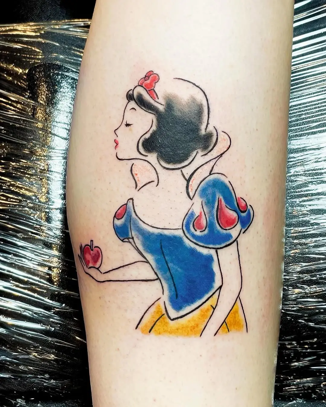 Whimsical portrayal of Snow White tattoo art