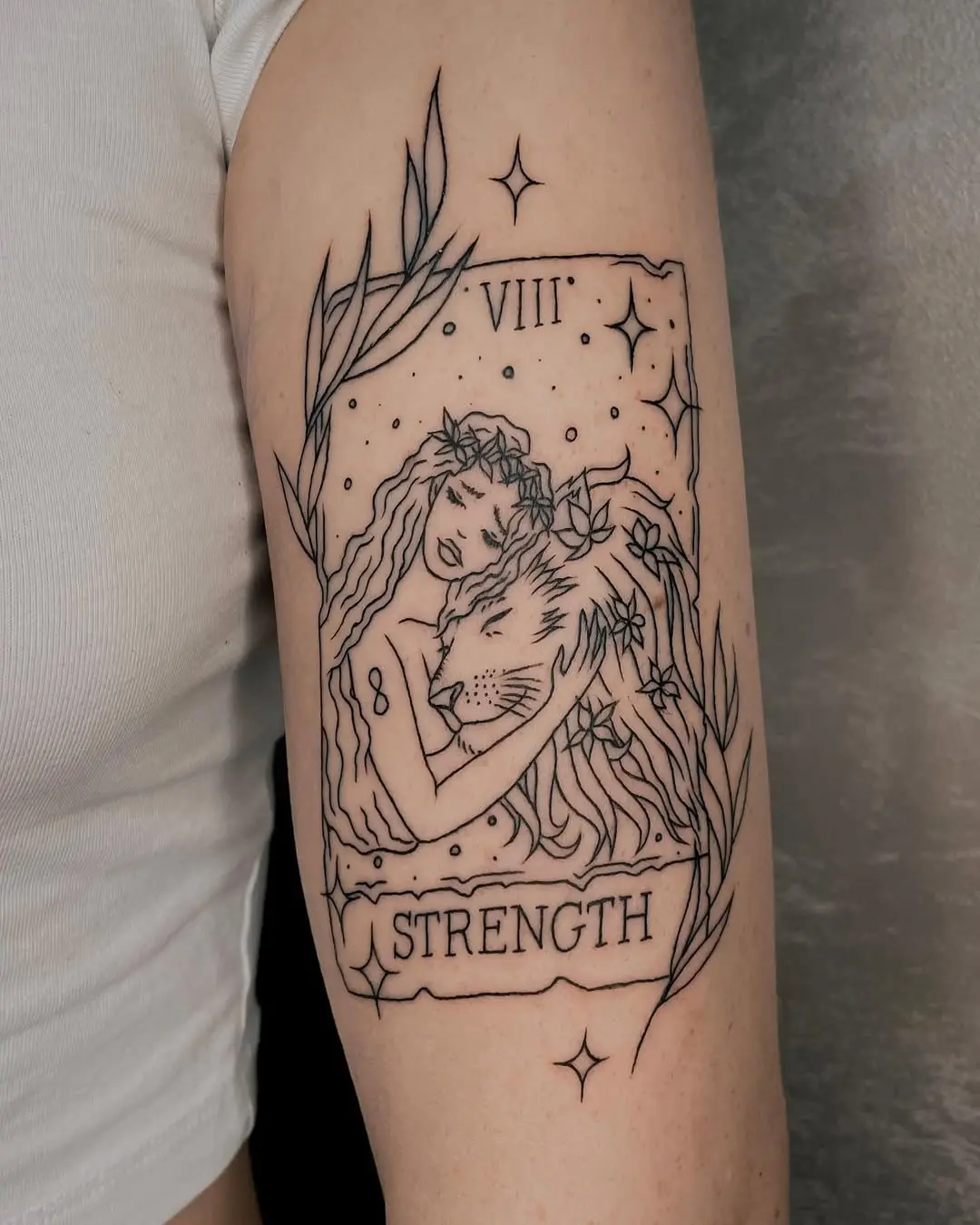 Elegant strength tattoo merging nature and power