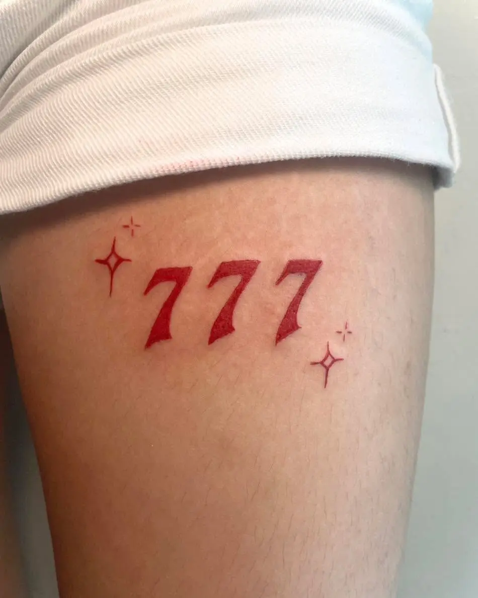 Vivid Red 777 Tattoo with Sparkling Stars