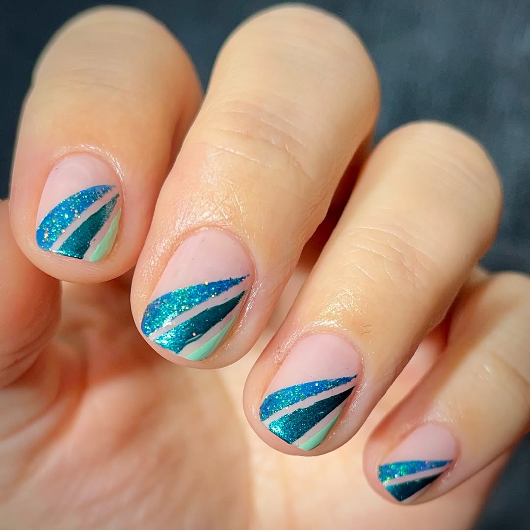 Vibrant teal glitter nail art design
