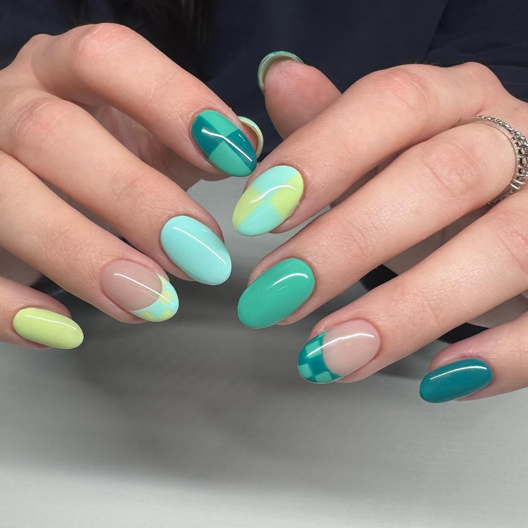 Vibrant teal nails with artistic flair