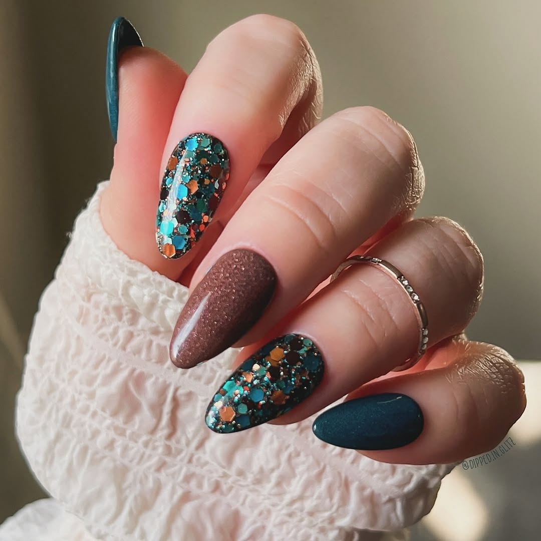 Stunning teal nail art with unique detailing