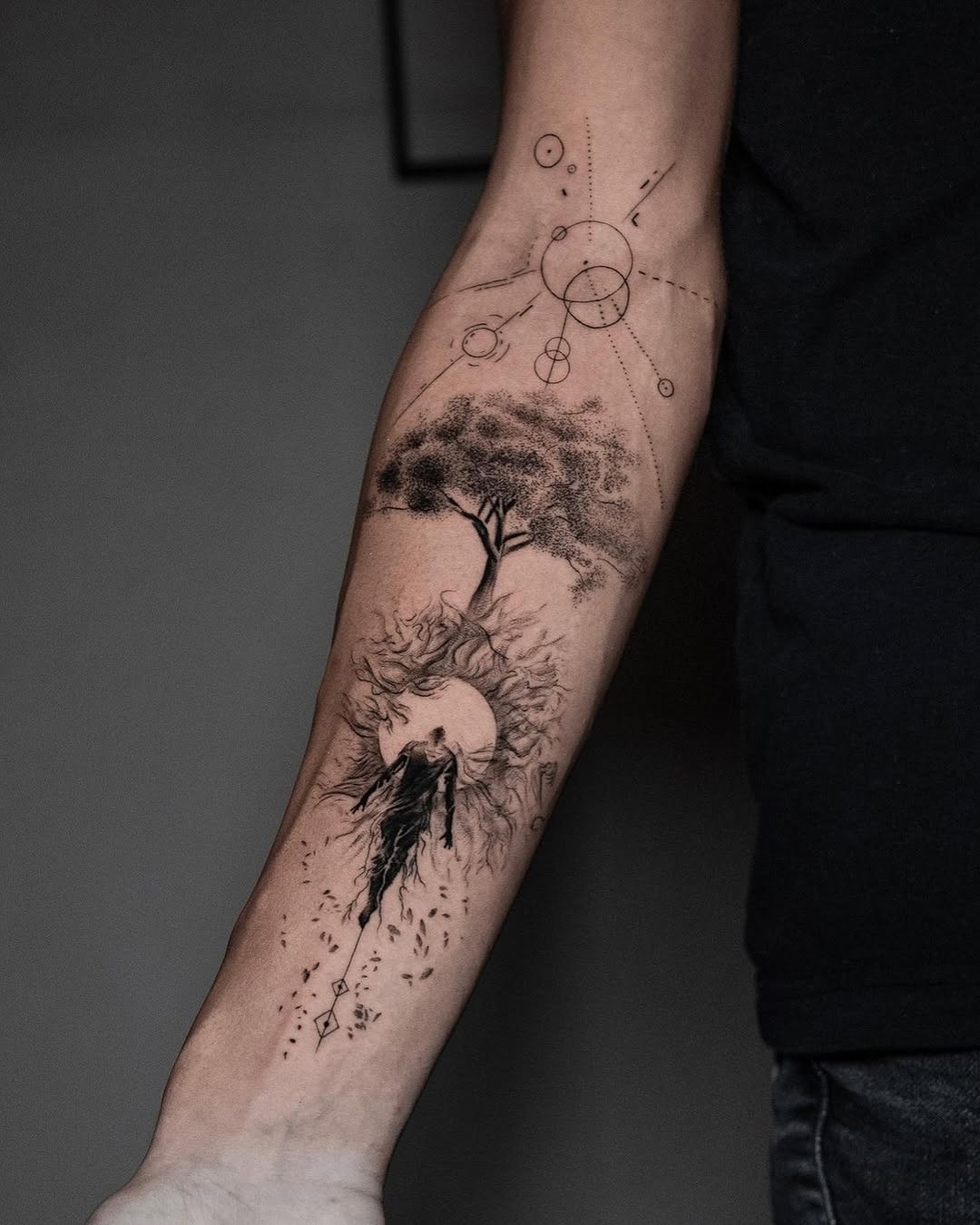Artistic tree tattoo with cosmic elements