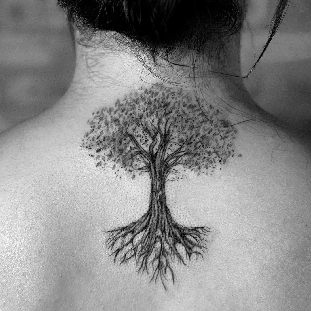 Intricate tree tattoo with visible roots and branches