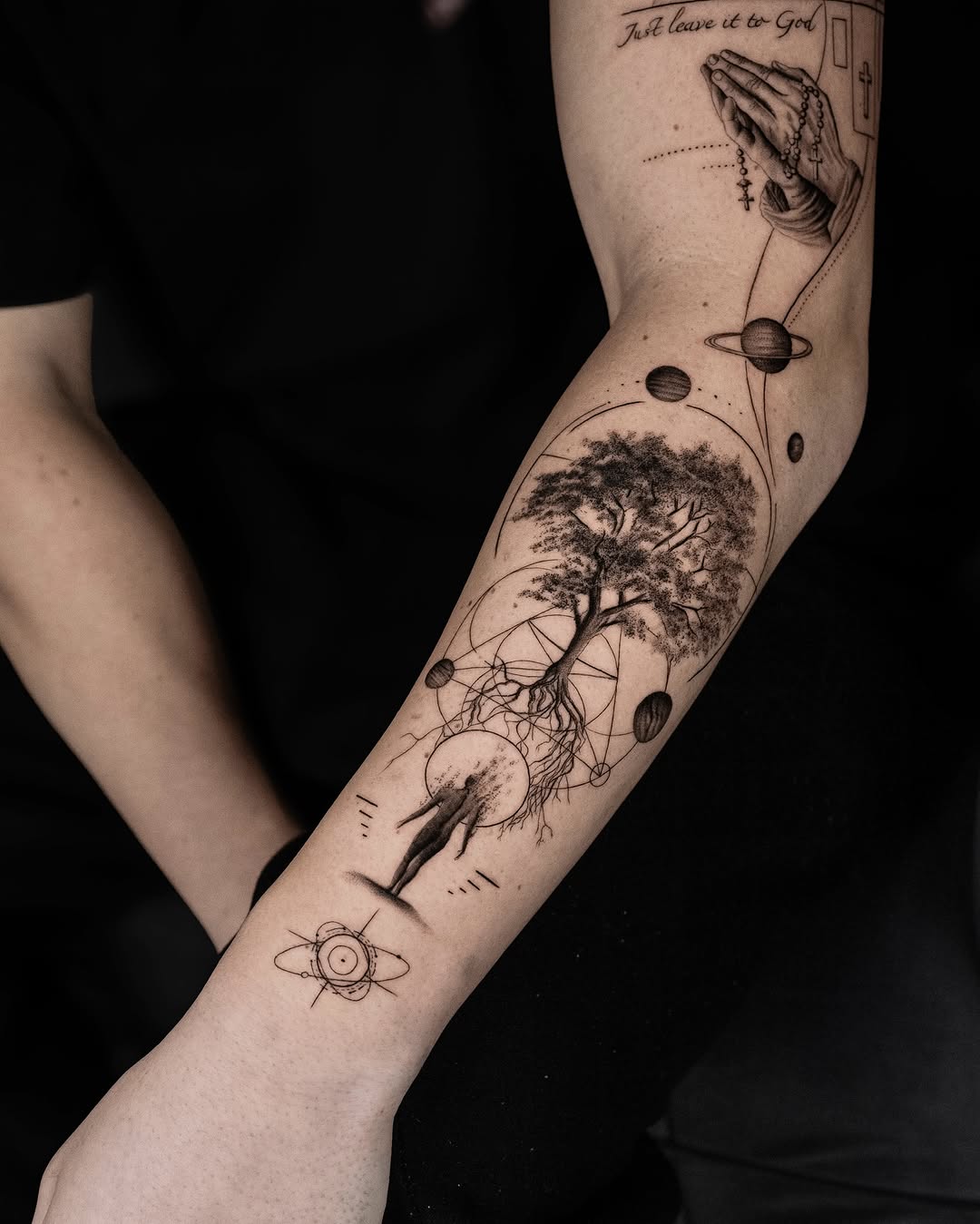 Intricate tree tattoo with cosmic elements