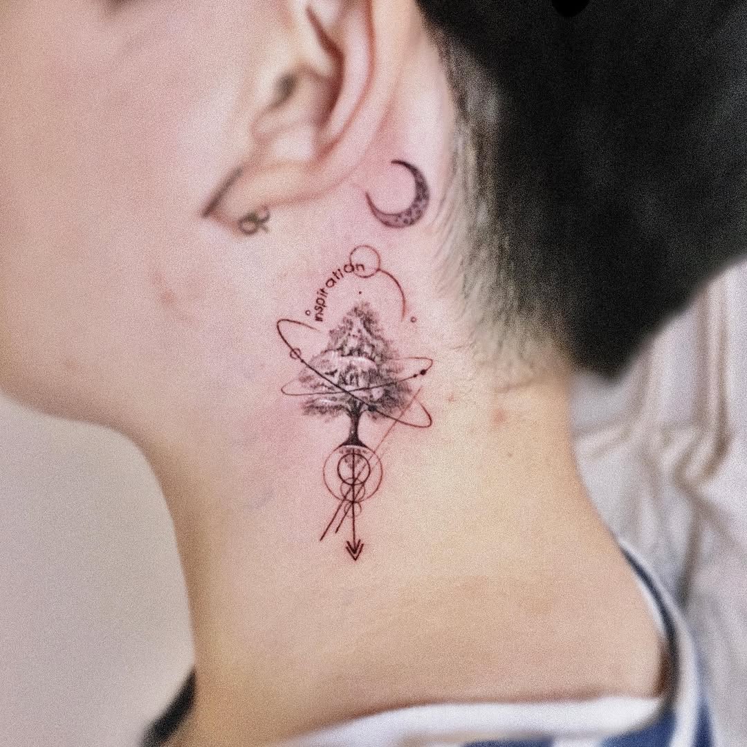 Artistic tree tattoo with cosmic elements