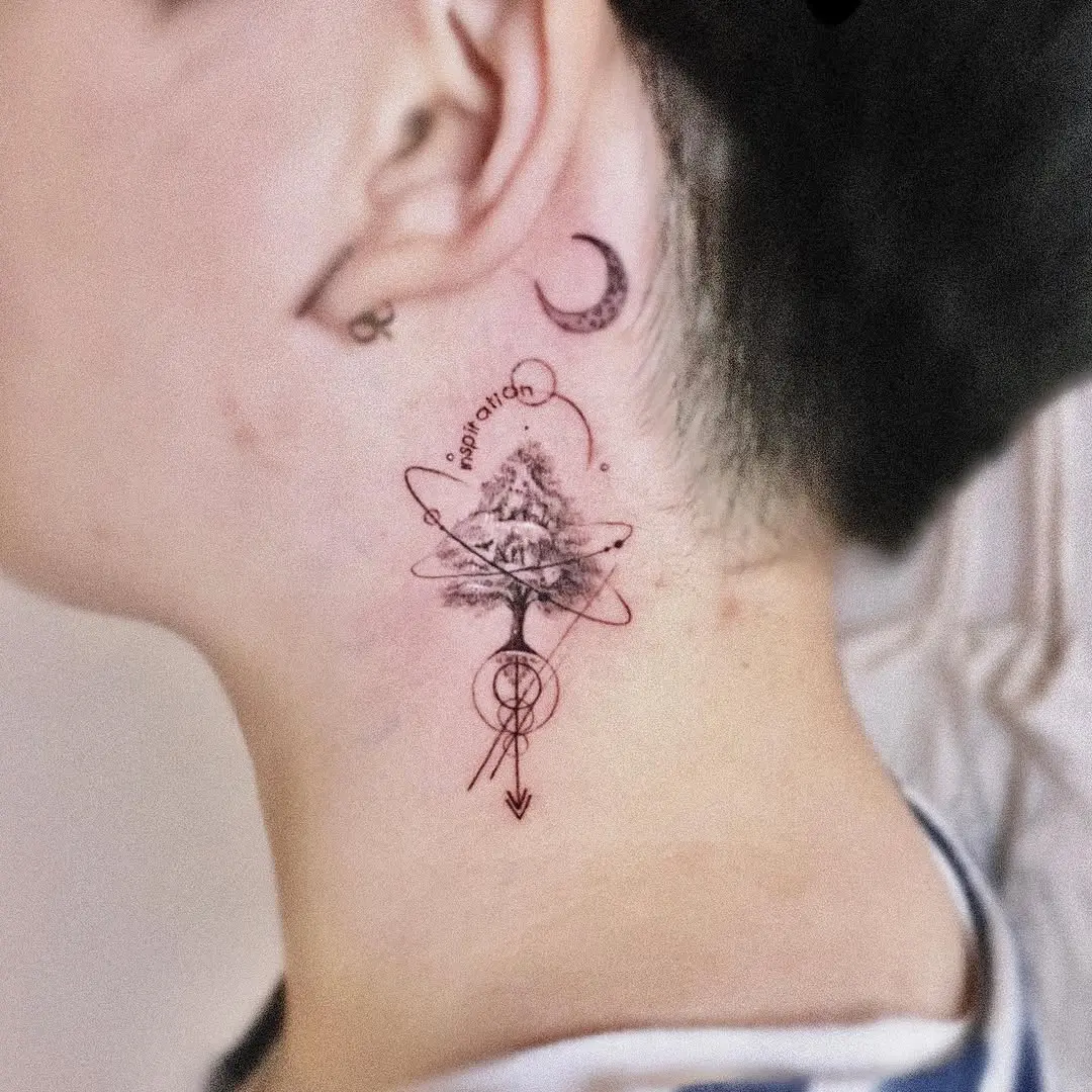 Artistic tree tattoo with cosmic elements