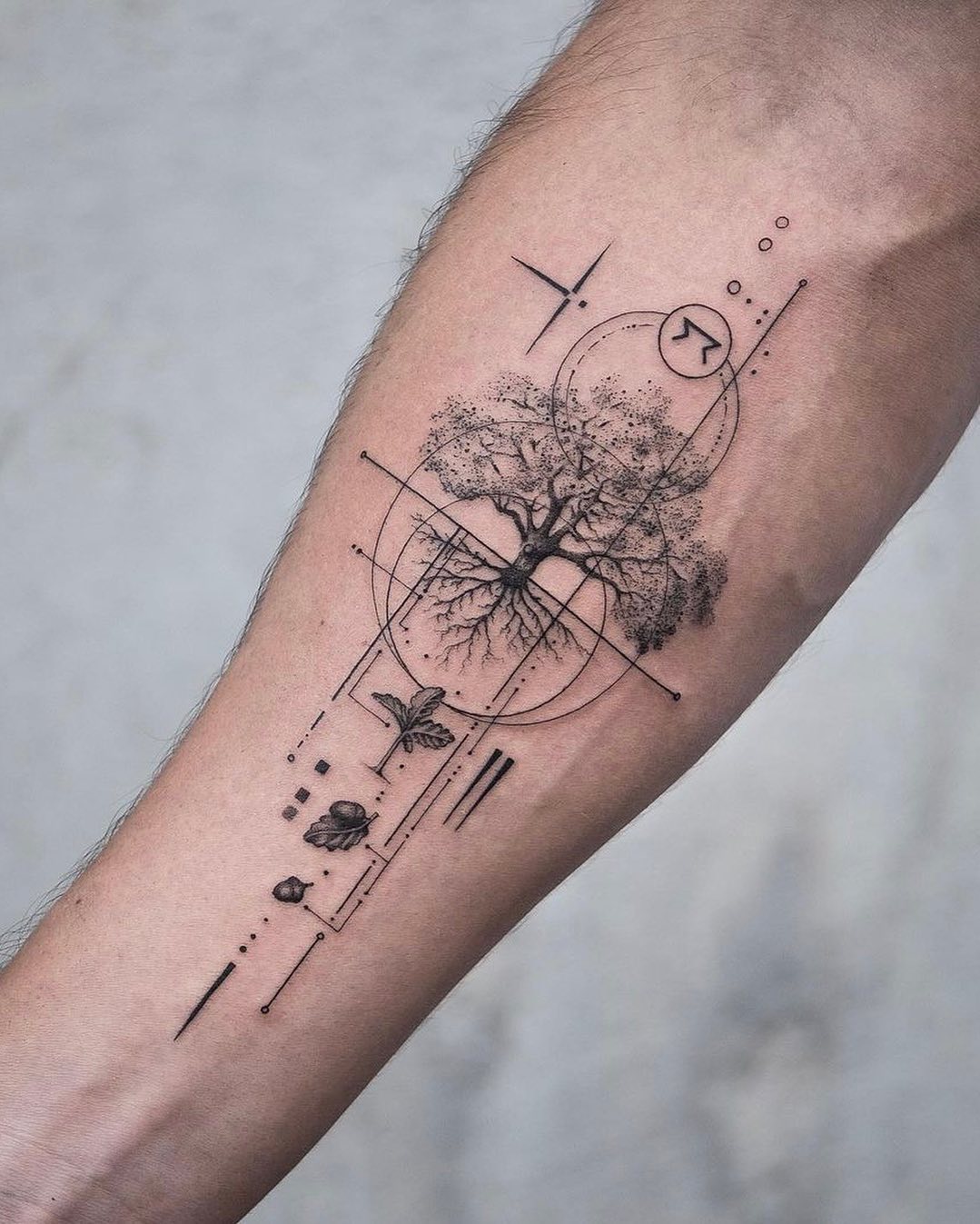 Intricate tree tattoo with geometric accents