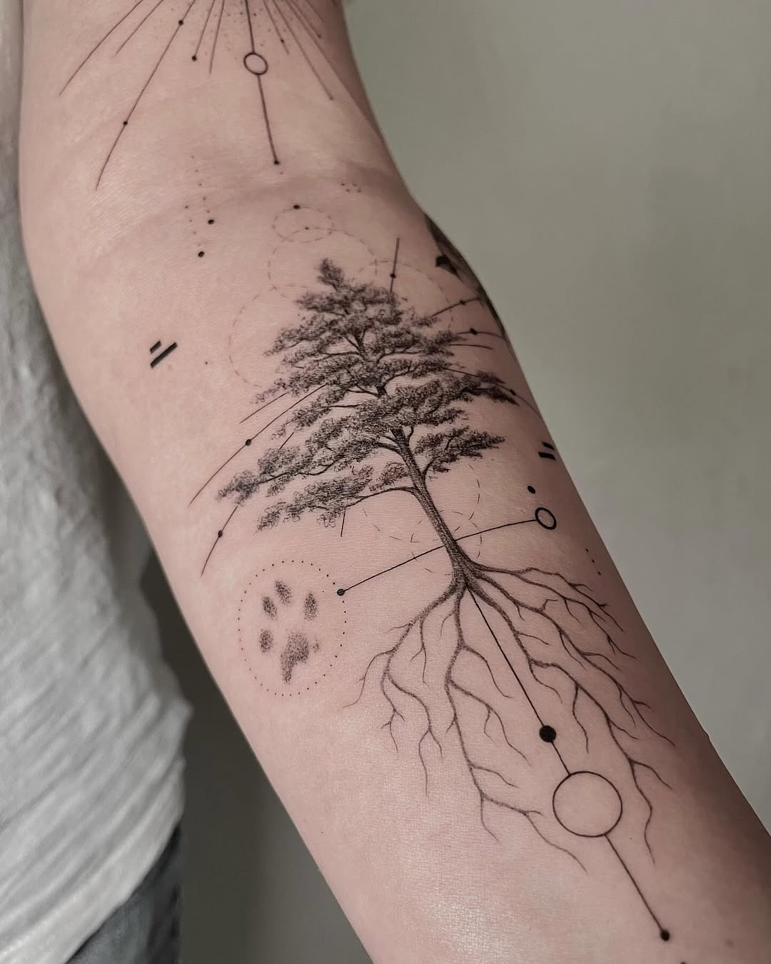 Intricate tree tattoo with geometric elements