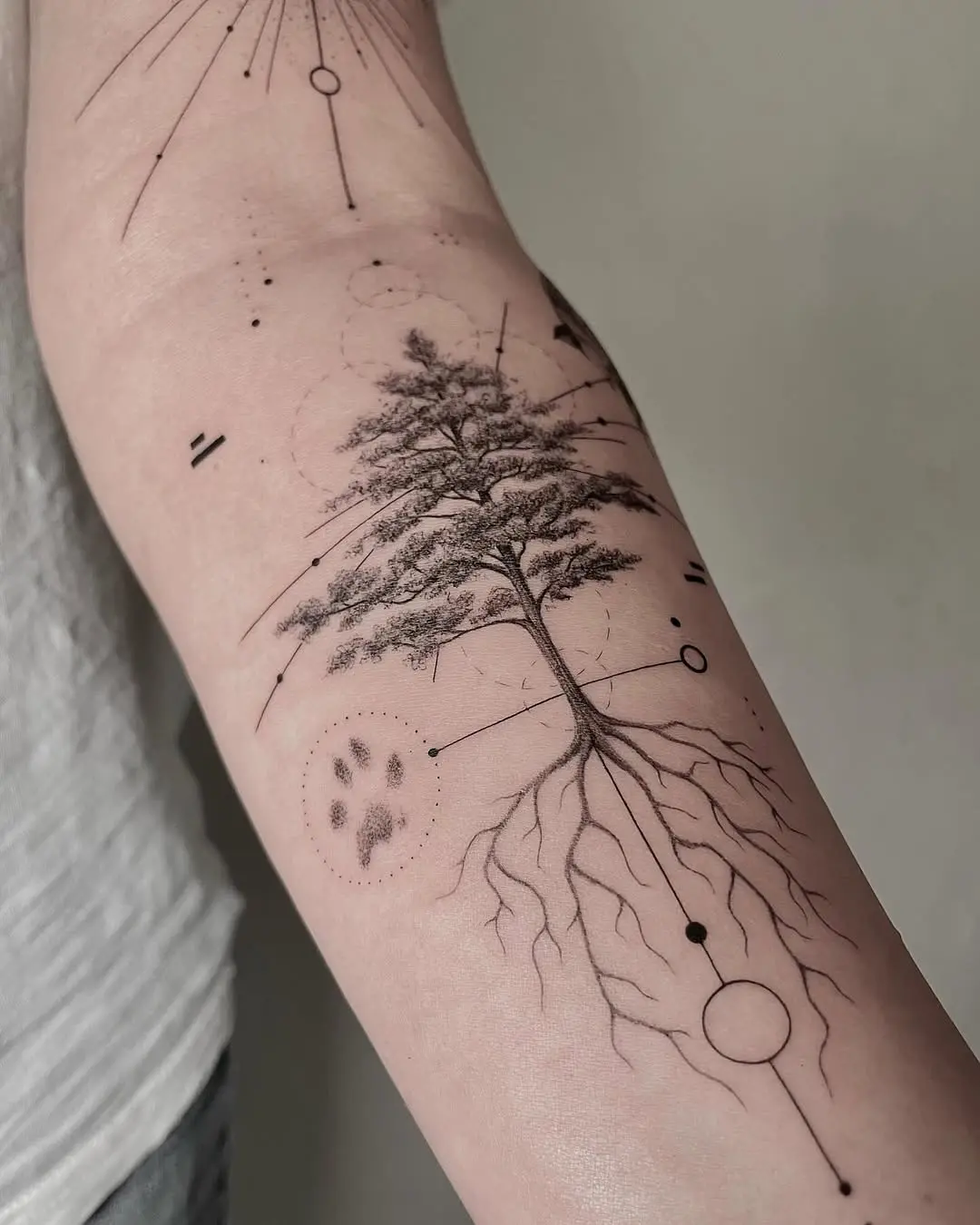 Intricate tree tattoo with geometric elements