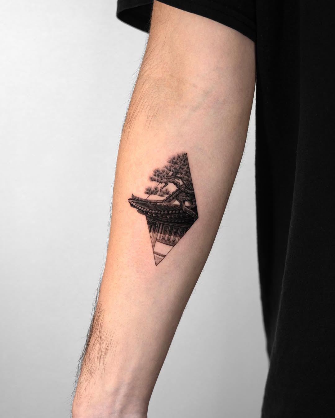 Geometric tree tattoo with traditional elements