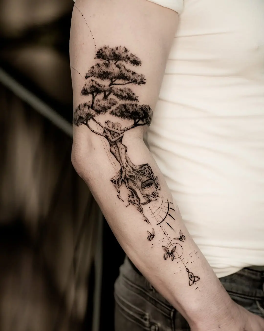 A whimsical tree tattoo capturing nature's beauty.
