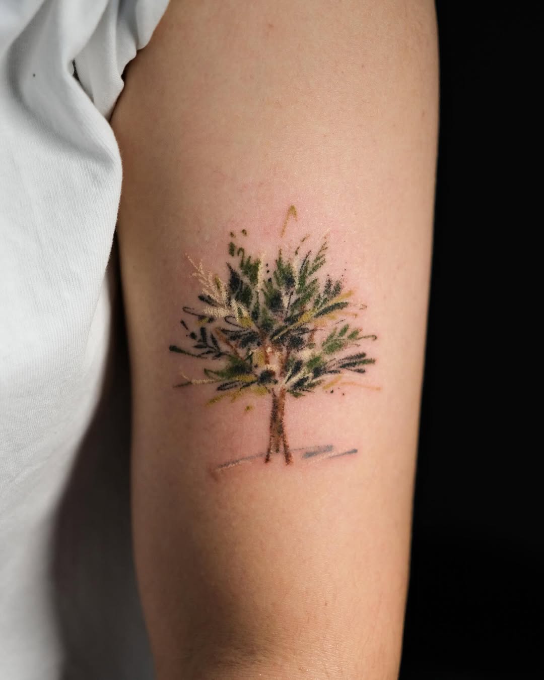 Artistic tree tattoo with vibrant colors and detail