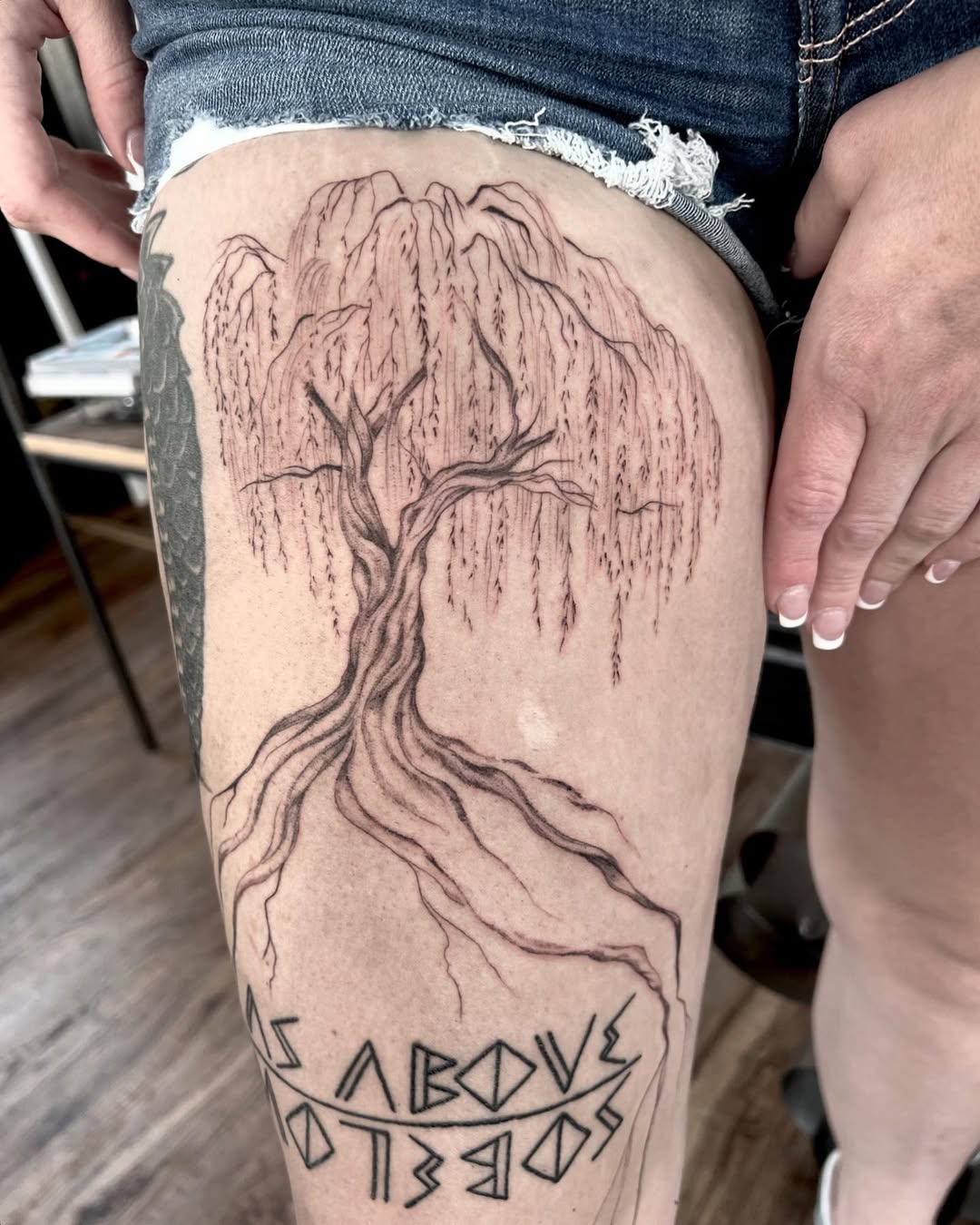Stunning weeping willow tree thigh tattoo