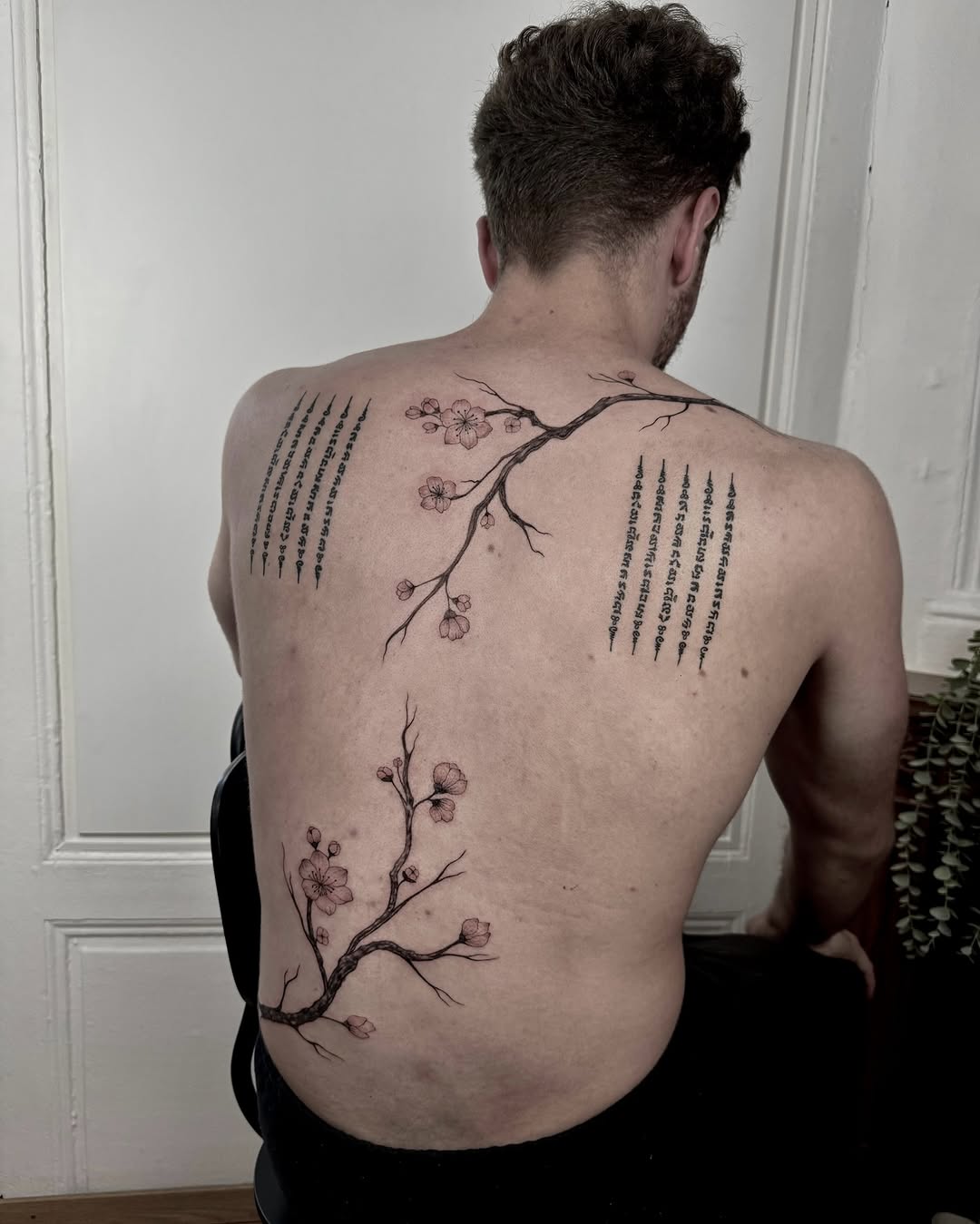 Elegant floral tree tattoo on the back