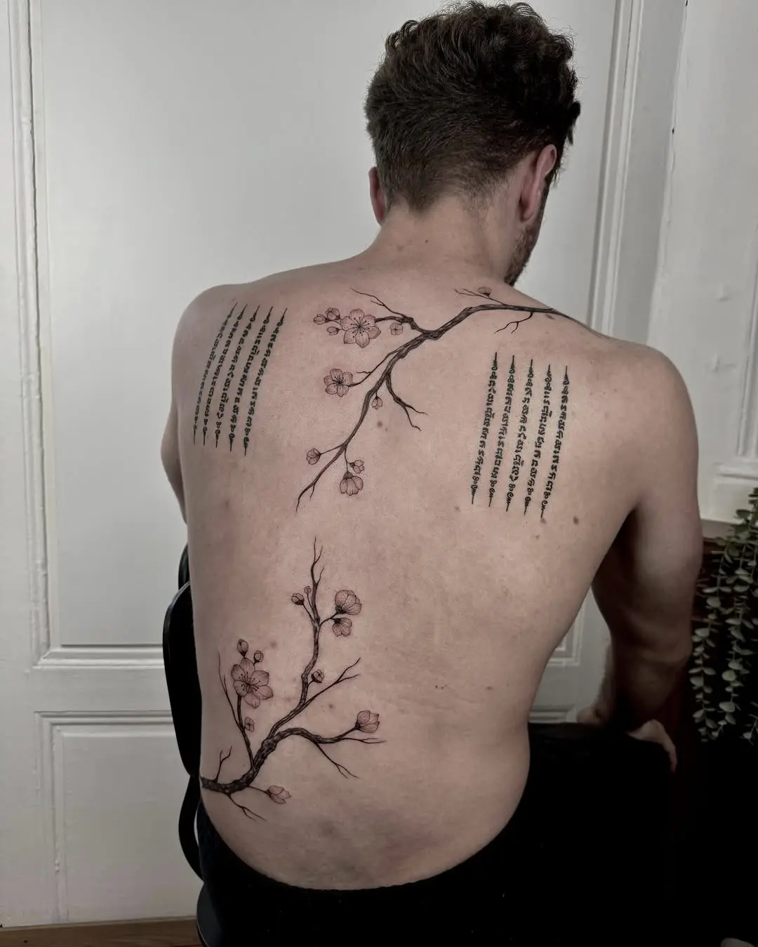 Elegant floral tree tattoo on the back