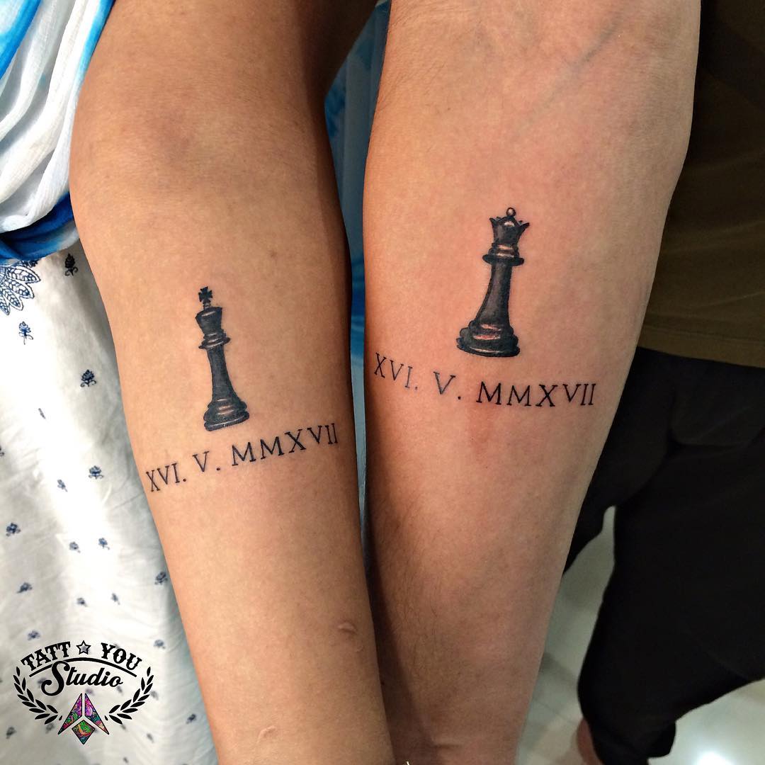Symbolic twin tattoos showcasing chess pieces