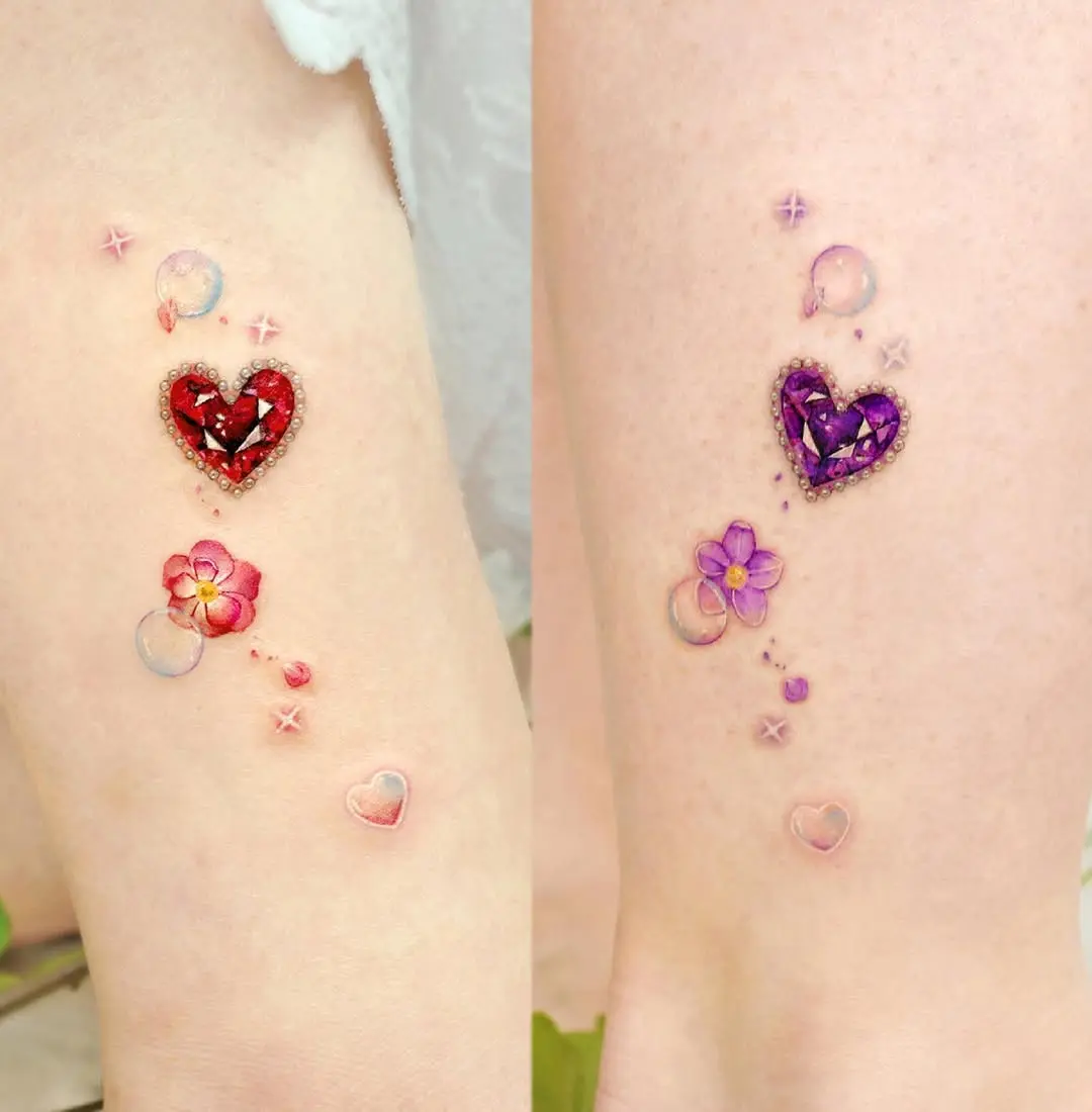 Stunning twin heart tattoos with floral accents