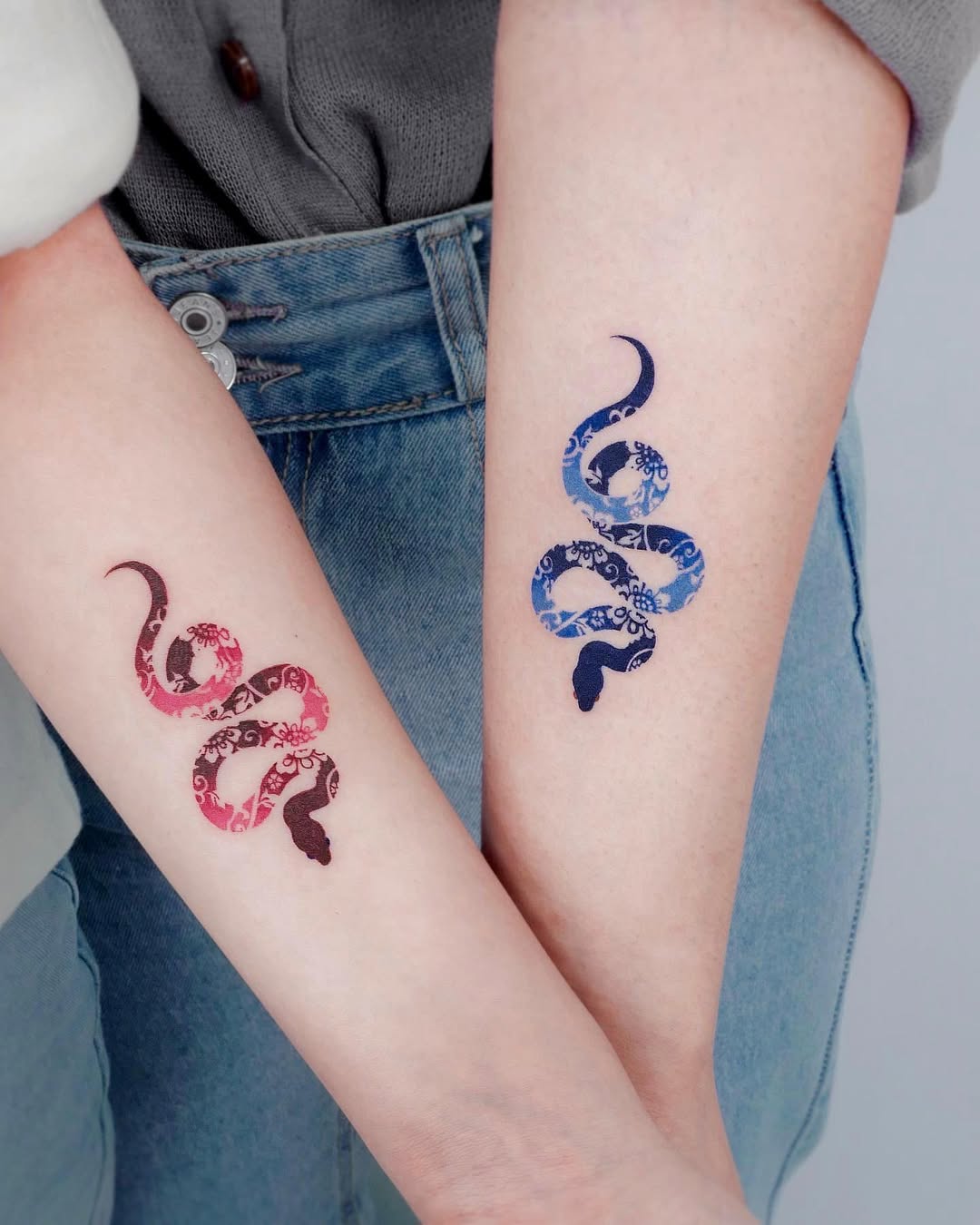 Intricate twin snake tattoos for best friends