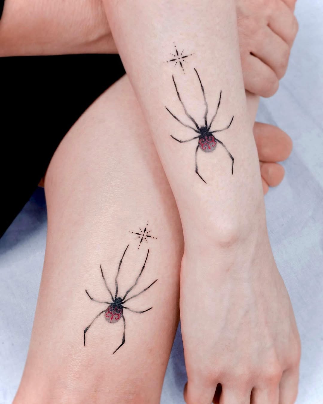 Elegant Twin Spider Tattoos with Star Accents