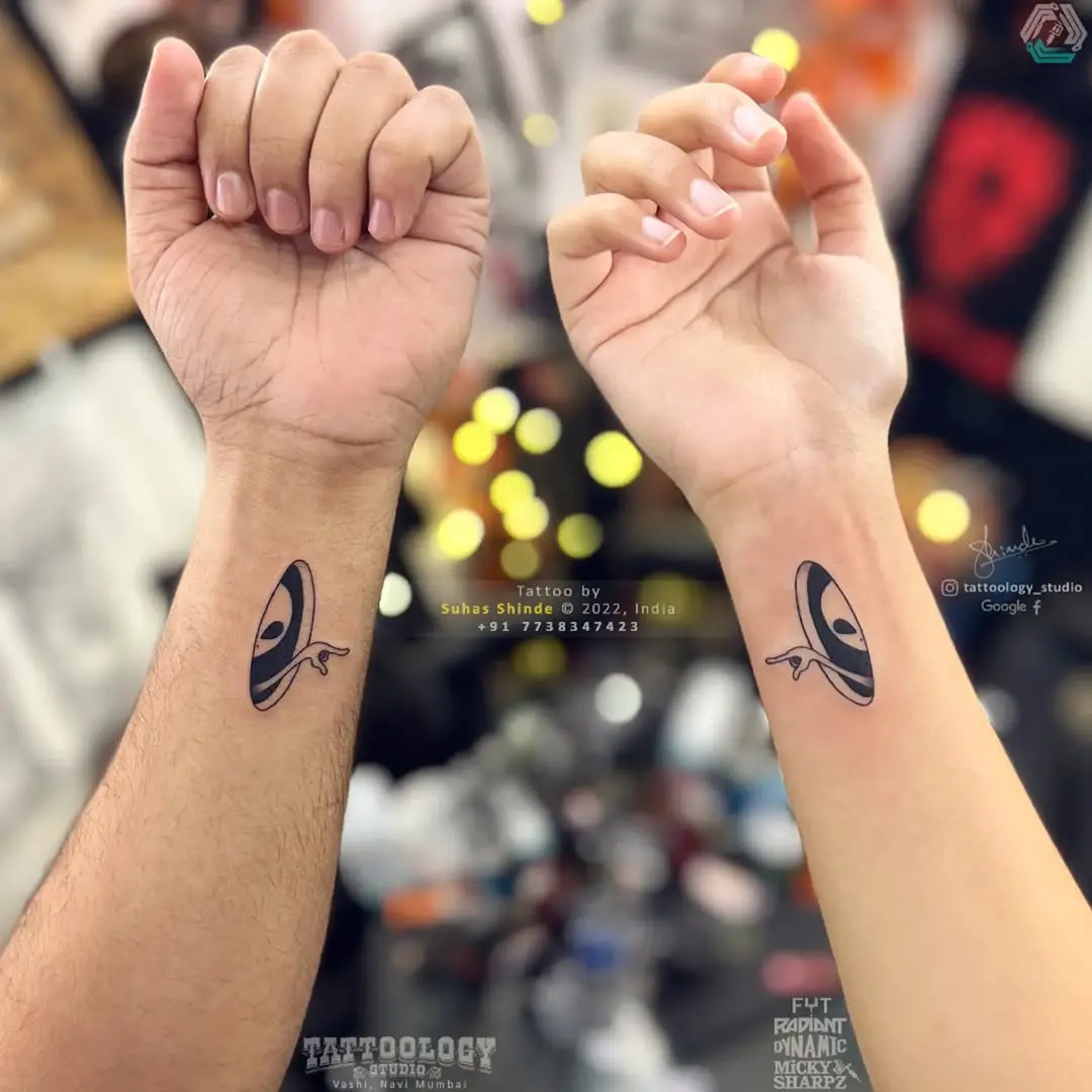Unique Twin Tattoos with Eye Motif