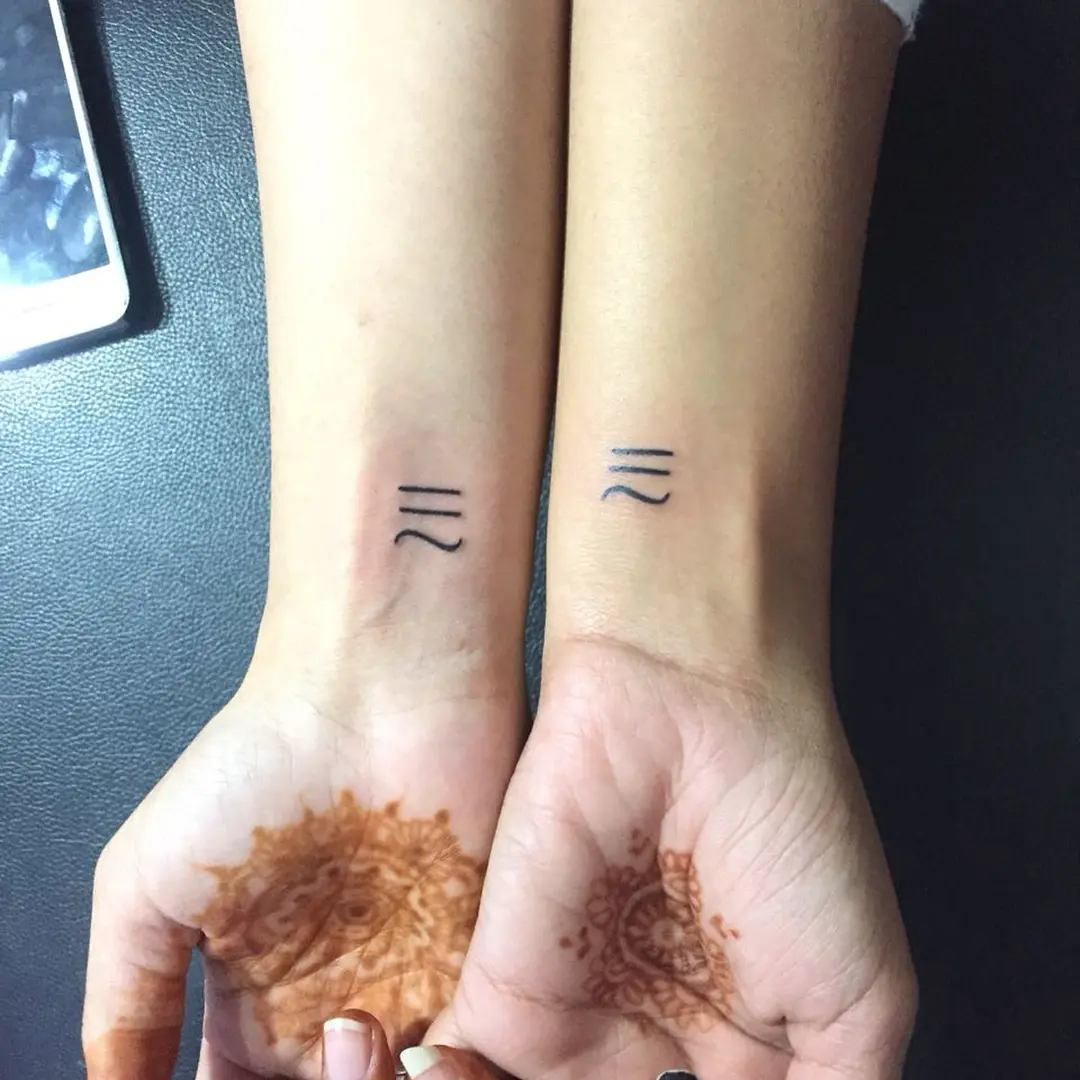 Symbolic twin tattoos with a modern touch