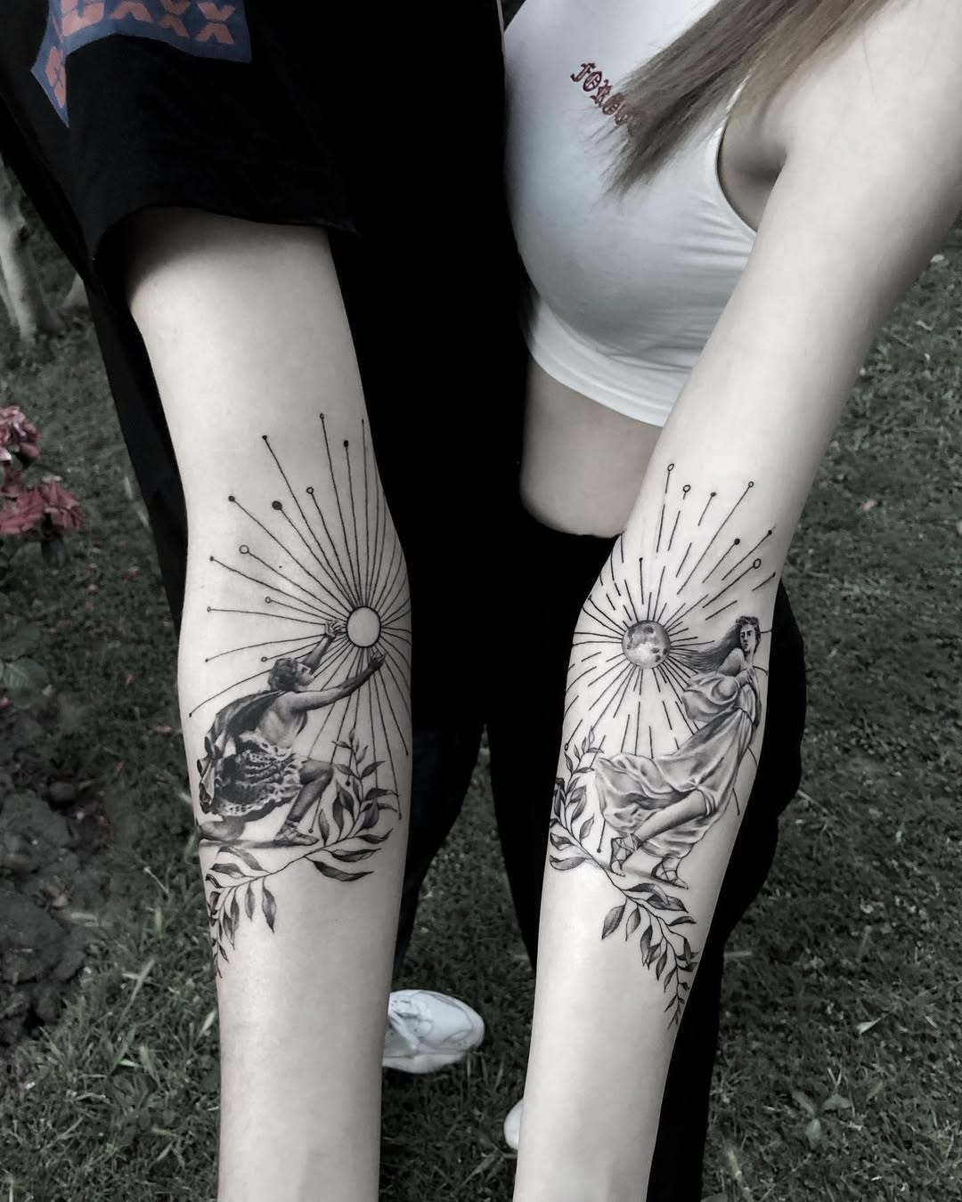 Beautiful twin tattoos of sun and moon