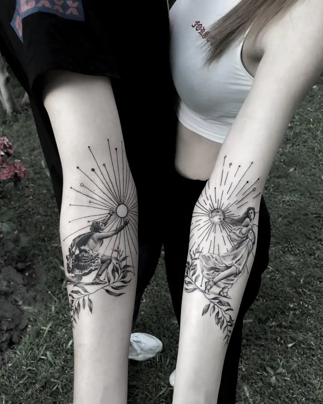 Beautiful twin tattoos of sun and moon