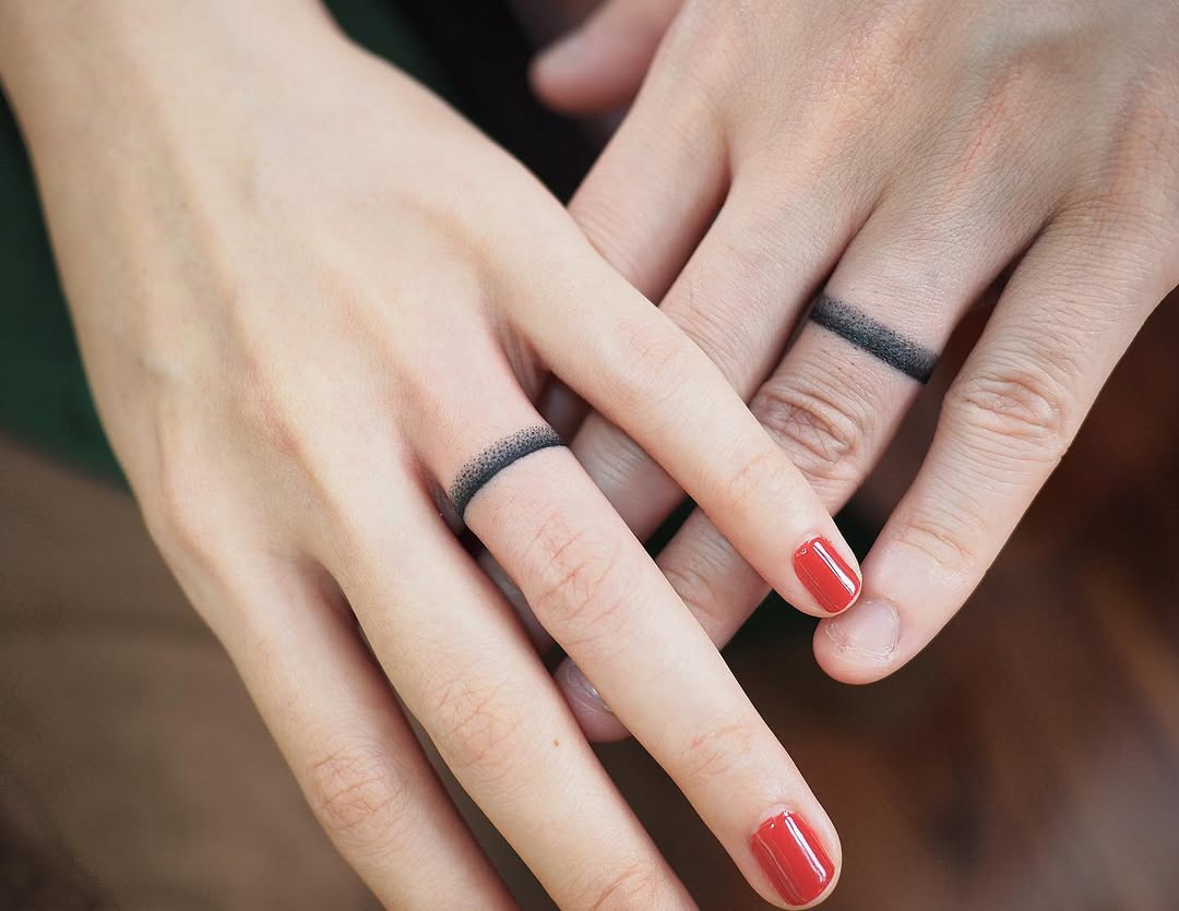 Stylish black band tattooed wedding rings