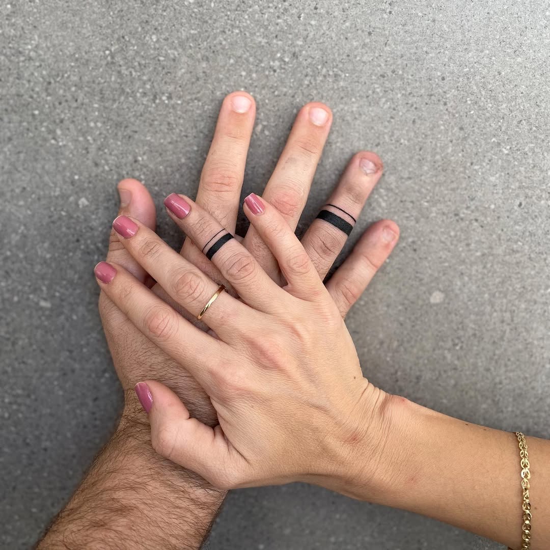 Stylish black ink wedding ring tattoo design