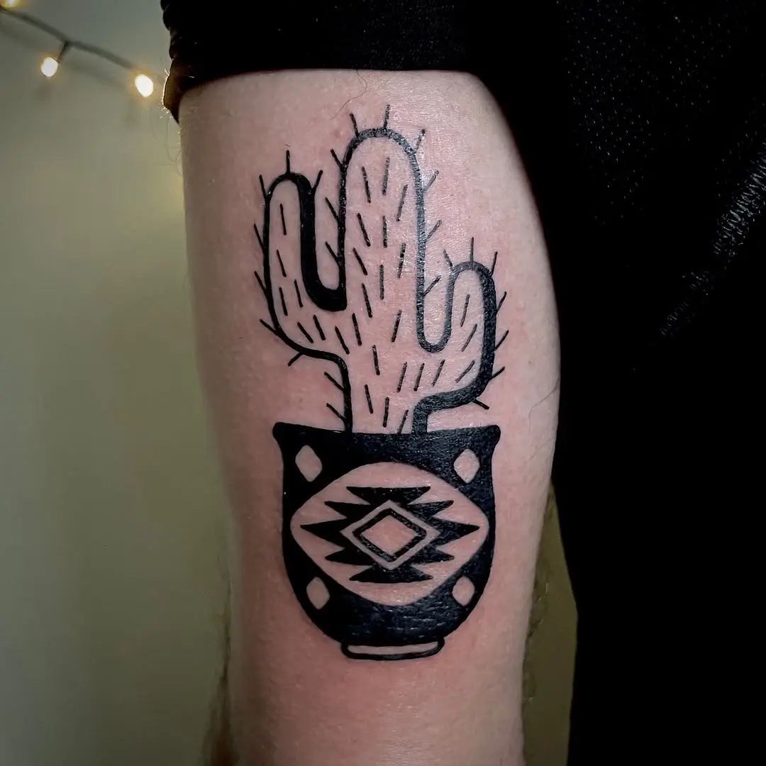 Unique cactus tattoo in a decorative pot