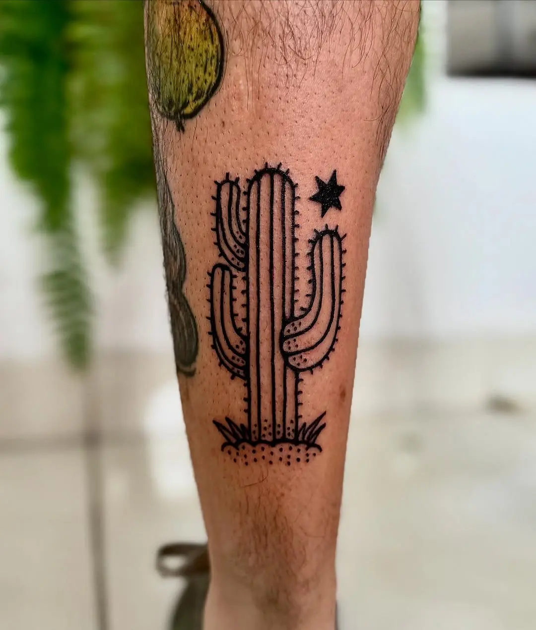 Elegant black ink cactus tattoo design
