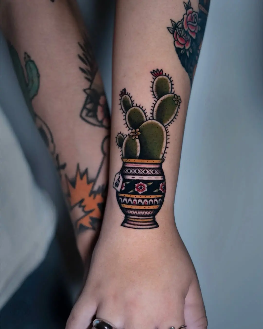 Charming cactus tattoo in a decorative pot