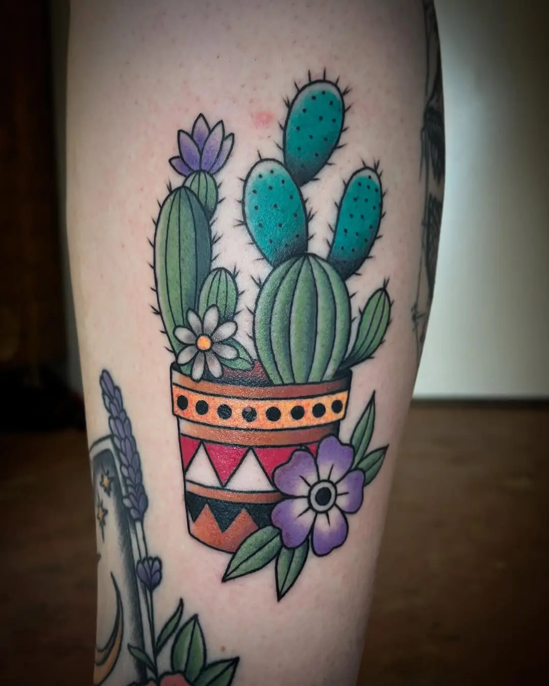 Colorful potted cactus tattoo design