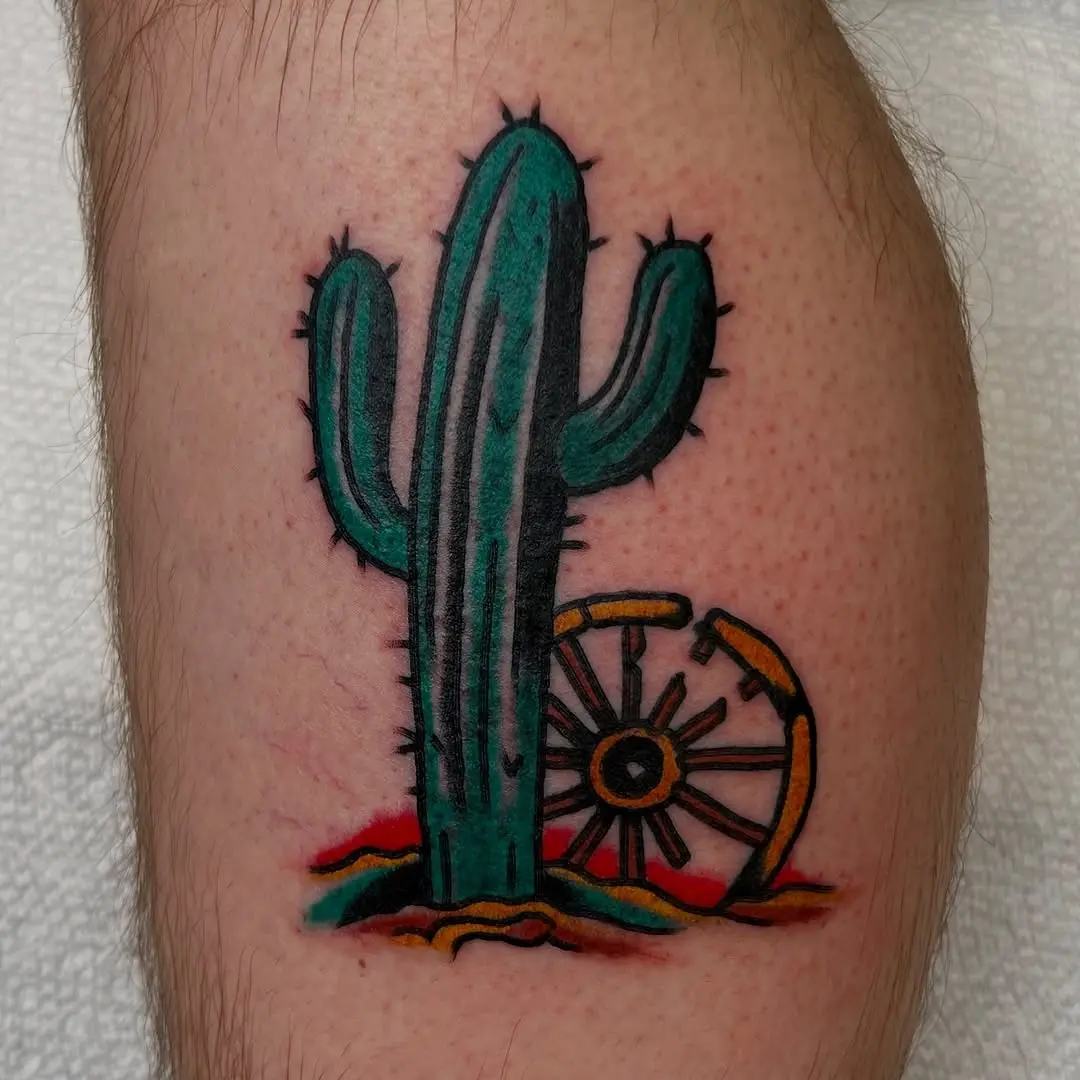 Vibrant cactus and wagon wheel tattoo design