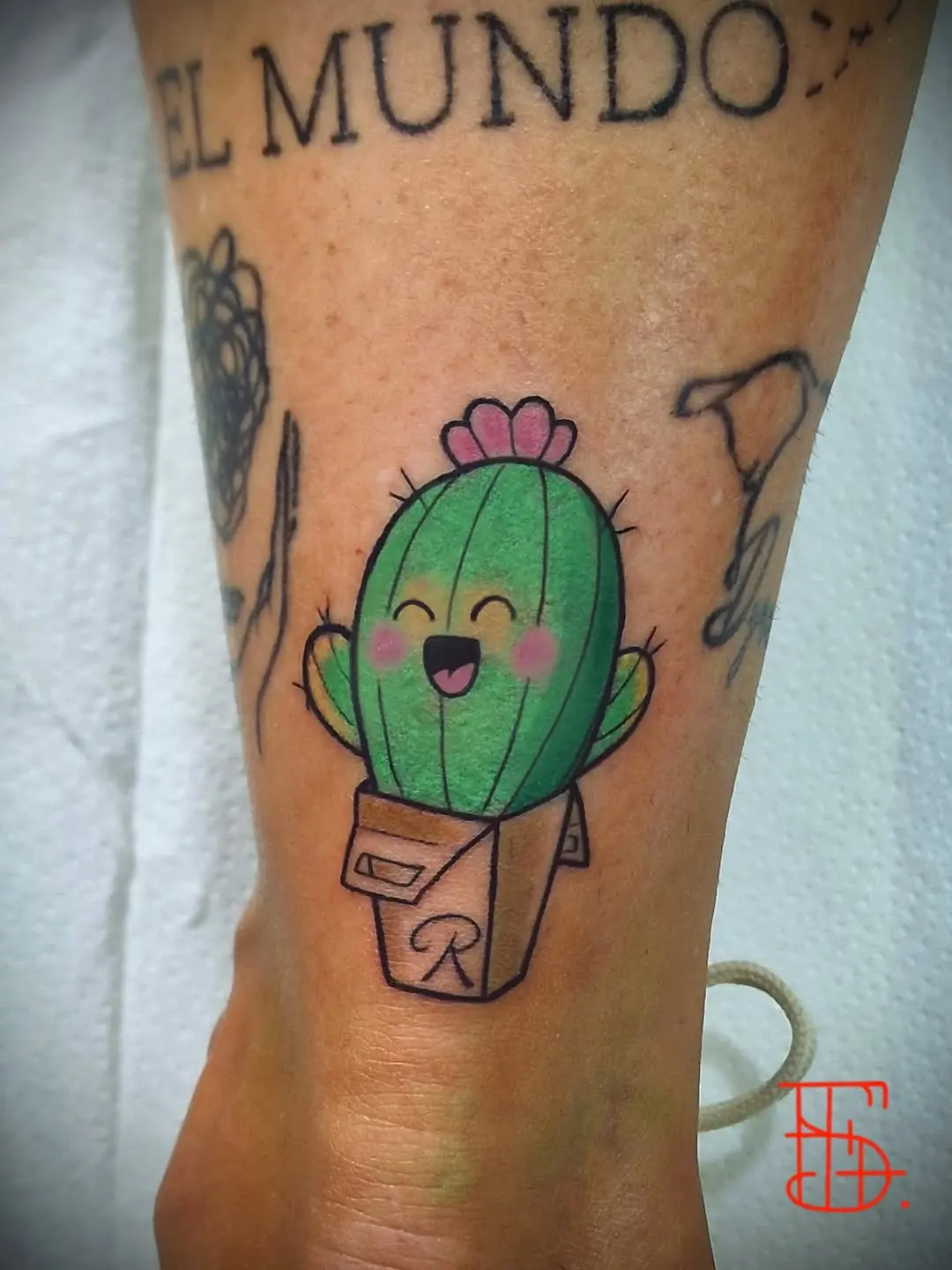 Charming cactus tattoo with a joyful expression